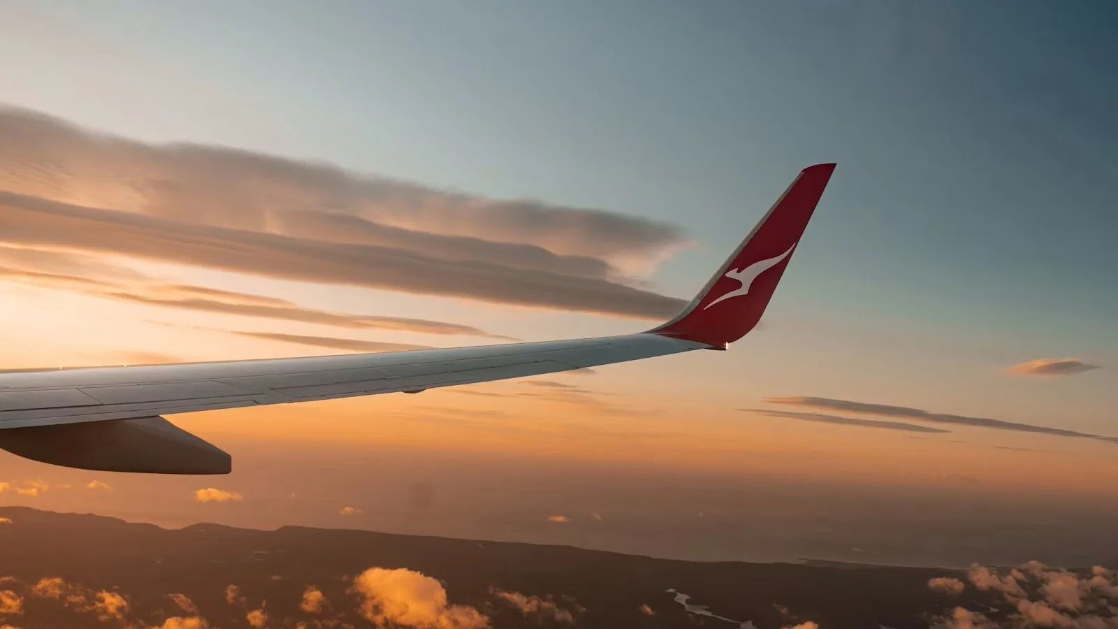 Qantas aircraft in flight, representing the 2026-27 Frequent Flyer status changes